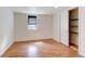 A bedroom with laminate wood flooring and a closet for plenty of storage at 1548 Ulster St, Denver, CO 80220