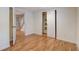 This room features hardwood floors, a closet, and an open doorway, creating a cozy and inviting space at 1548 Ulster St, Denver, CO 80220