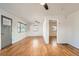 Open living space showcasing beautiful hardwood floors and a neutral color palette at 1548 Ulster St, Denver, CO 80220