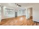 Inviting living area with beautiful hardwood floors and ceiling fan at 1548 Ulster St, Denver, CO 80220