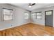 Inviting living space boasts hardwood floors, natural light, and gray door at 1548 Ulster St, Denver, CO 80220