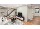 Finished basement living room with modern decor and updated flooring at 1548 Ulster St, Denver, CO 80220