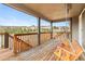Inviting back porch featuring a wooden swing, perfect for relaxing outdoors and enjoying neighborhood views at 1356 Castle Creek Cir, Castle Rock, CO 80104