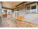 Relaxing back porch with a wooden swing, ideal for unwinding and enjoying quiet moments outdoors at 1356 Castle Creek Cir, Castle Rock, CO 80104