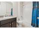 Bathroom featuring a tub and shower combination, granite vanity, and tile flooring at 1356 Castle Creek Cir, Castle Rock, CO 80104