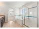 Bright bathroom with granite counters, soaking tub, and glass-enclosed shower, offering spa-like amenities at 1356 Castle Creek Cir, Castle Rock, CO 80104