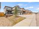 Exterior of a two story home with a three car garage, gravel landscaping, and a manicured lawn at 1356 Castle Creek Cir, Castle Rock, CO 80104