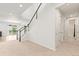 Spacious foyer with staircase, leading to the upper level and offering a glimpse of the living spaces at 1356 Castle Creek Cir, Castle Rock, CO 80104