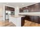 Modern kitchen featuring stainless steel appliances, granite countertops, and a stylish center island at 1356 Castle Creek Cir, Castle Rock, CO 80104