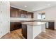 Well-lit kitchen featuring granite countertops, stainless steel appliances, and wooden cabinets at 1356 Castle Creek Cir, Castle Rock, CO 80104