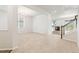 Bright living room with neutral carpet, white walls and an open floor plan at 1356 Castle Creek Cir, Castle Rock, CO 80104