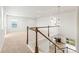 Bright open loft area with white railings and natural light, offering a versatile living space at 1356 Castle Creek Cir, Castle Rock, CO 80104