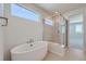 Modern bathroom featuring a soaking tub, walk-in shower, and contemporary finishes at 14155 Bunny Hop Ln, Parker, CO 80134
