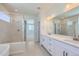 Primary bath featuring dual vanities, a separate shower, and modern fixtures at 14155 Bunny Hop Ln, Parker, CO 80134