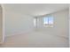 Bright, airy bedroom featuring plush carpeting, natural light and neutral paint at 14155 Bunny Hop Ln, Parker, CO 80134