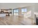 Spacious living space featuring a fireplace and sliding doors to the backyard for seamless indoor-outdoor living at 14155 Bunny Hop Ln, Parker, CO 80134
