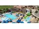 Aerial of a large clubhouse pool with waterslides, pools and sun loungers at 7565 S Quantock Ct, Aurora, CO 80016