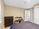 Bedroom featuring closet, dresser, lizard terrarium, with carpet, and a window to create a neutral space at 7669 Pecos St, Denver, CO 80221