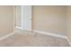 Neutral bedroom features carpet and a white door at 7669 Pecos St, Denver, CO 80221