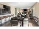 Inviting dining room with seating for six, flowing into a living room with a stone fireplace feature at 7669 Pecos St, Denver, CO 80221