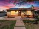 Exterior of a single story home with brick accents and solar panels at 7669 Pecos St, Denver, CO 80221