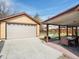 A detached garage and covered patio with outdoor seating is featured in the backyard at 7669 Pecos St, Denver, CO 80221