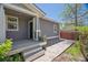 The backyard includes patio, gray siding, and string lights at 2924 Fulton St, Denver, CO 80238