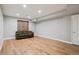 Finished basement area featuring wood floors, neutral paint and recessed lighting at 2924 Fulton St, Denver, CO 80238