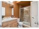 Bathroom featuring tile shower, vanity and natural light at 2924 Fulton St, Denver, CO 80238