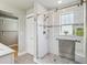 Newly renovated bathroom showcasing a glass shower and subway tile at 2924 Fulton St, Denver, CO 80238