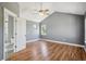 Spacious bedroom with vaulted ceilings, hardwood floors, a ceiling fan and ensuite bathroom at 2924 Fulton St, Denver, CO 80238