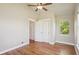Bedroom featuring hardwood floors, a ceiling fan, and natural light from the window at 2924 Fulton St, Denver, CO 80238