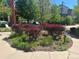 Landscaped front yard with colorful bushes and green lawn at 2924 Fulton St, Denver, CO 80238