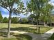 Picturesque green space surrounded by trees and charming neighborhood homes at 2924 Fulton St, Denver, CO 80238