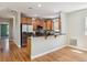 Modern kitchen with stainless steel appliances, a breakfast bar, and ample cabinet space for a functional and stylish cooking area at 2924 Fulton St, Denver, CO 80238