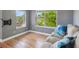 Comfortable living room showcasing bright windows, hardwood floors, and plush seating at 2924 Fulton St, Denver, CO 80238