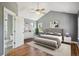 Spacious main bedroom with vaulted ceiling, fan, and ensuite bathroom at 2924 Fulton St, Denver, CO 80238