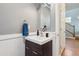 Stylish powder room with modern vanity, mirror, and decorative fixtures at 2924 Fulton St, Denver, CO 80238