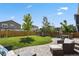 Backyard features a well-maintained lawn, a playset, and a paver patio at 13144 E 109Th Pl, Commerce City, CO 80022