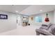 Finished basement featuring TV, entertainment center, and comfortable seating at 13144 E 109Th Pl, Commerce City, CO 80022