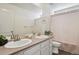 Bathroom featuring double sinks, and a shower with curtain at 13144 E 109Th Pl, Commerce City, CO 80022