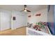 Bedroom featuring carpet, ceiling fan, and a closet with white doors at 13144 E 109Th Pl, Commerce City, CO 80022