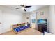 Bright bedroom with a colorful bed, fish tank, and natural light at 13144 E 109Th Pl, Commerce City, CO 80022