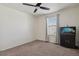 Bedroom featuring a ceiling fan, plush carpet, and window with blinds at 13144 E 109Th Pl, Commerce City, CO 80022