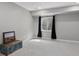 Bedroom with a window, gray carpet and a vintage chest at 13144 E 109Th Pl, Commerce City, CO 80022