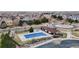 Aerial view of a community pool with a covered blue tarp for protection and maintenance at 13144 E 109Th Pl, Commerce City, CO 80022