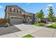 Charming home with a two-car garage, lush lawn, and inviting curb appeal at 13144 E 109Th Pl, Commerce City, CO 80022