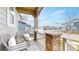 Inviting front porch with comfortable seating, providing a relaxing outdoor space at 13144 E 109Th Pl, Commerce City, CO 80022