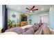 Cozy living room boasts a large sectional sofa, decorative plants, and a wooden media center at 13144 E 109Th Pl, Commerce City, CO 80022