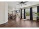 Spacious living area that flows into the dining room and kitchen, bathed in natural light at 13144 E 109Th Pl, Commerce City, CO 80022
